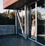 Doors, Metal, Exterior, and Sliding Door Type Maricarmen looks out toward the ocean from inside the sliding glass NanaWall.  Photos from Double the Pleasure