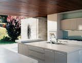 Kitchen and White Cabinet The kitchen is done up in Gaggenau and Bulthaup.  Photo 7 of 11 in Double the Pleasure