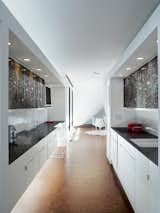 The kitchen is a long sleek space.