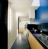 The kitchen is a vibrant deep blue. "It's the same color Le Corbusier used in the corridor of his Villa Savoye in Poissy," Van Everbroeck reports.