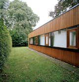 Only the rear of the house suggests the building’s earlier incarnation as a 1960s bungalow, and even here the original brickwork is obscured by wood cladding.