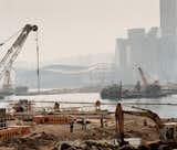 Workers survey the harbor-reclamation efforts.  Photo 8 of 13 in Hong Kong, China