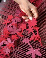 SPN Carpets, which is on the outskirts of Delhi, is the company that Nanimarquina tasks to manufacture their Boontje-designed rug, Little Field of Flowers. Here, a technician holds up a flower before it’s tucked into the loom.