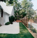 Outdoor, Walkways, and Grass Patches of sod amid white gravel keep water needs low.  Search “keep-these-in-mind-prints.html” from Salvage Love