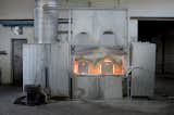 The furnaces at Vetrerie New Glass, one of the facilities that Flos contracts to produce its Glo-Ball, burn at around two-thousand degrees celsius–temperatures at which sand becomes molten glass.