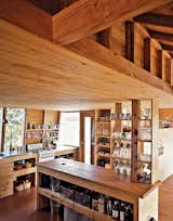 The kitchen reveals the detailed precision with which the Thoms assembled their home: Exact cuts, joins, and cantilevers bring the whole house together.  Photo 5 of 9 in Wood Interior by Eric Innis from On the Rock