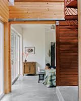 Kurokawa and Fishman's son Danny Fishman-Engel enjoys time away from the city by studying magic tricks in his bedroom. Sliding slatted doors separate the asymmetrical downstairs spaces.
