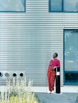 The building’s stark but well-windowed exterior is clad with ridged sheets of stainless steel. Dorothy Barry steps outside for a breath of fresh air.  Photo 6 of 8 in Inside Chicago’s Helmut Jahn–Designed Supportive Housing Development