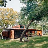 Maintaining a connection to their wooded backyard was an important consideration for the Edstroms. The back wall is designed to let in as much light and air as possible.