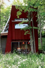 Exterior, Metal Roof Material, and Metal Siding Material The screened-in porch.   from Scrap House