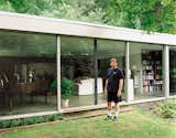 North stands outside his glass-walled living room, which also houses his small library of books about Breuer.