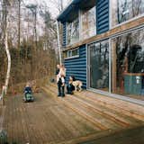 The addition includes a large timber deck at the front, where the family can lounge and enjoy the lush scenery.