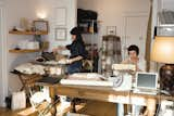 In her sunny studio, Joanna Notkin (left) assembles pillows while Anna Borstand, who manages sampling and production, carefully threads a needle.