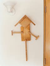 In the bedroom, a "scarecrow" crafted by the Goodmans' grandson Eli hangs on the wall.  Photo 3 of 7 in Raising the Barn