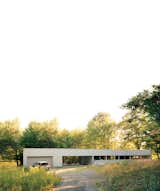 This steel-and-glass house, set amid dense forest south of Ithaca, New York, captivated Maria Cook and Lance Compa when they first toured it in 2004. They bought it not long afterward and turned it into a weekend retreat.