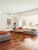 Medium Hardwood Floor and Coffee Tables The low-slung Strata sofa by King Furniture is perfect for “sleeping.”  Photo 2 of 8 in Minimalist Bachelor Pad in Brisbane