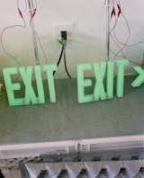 Custom exit sign are seen in the office.