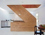 The wooden stairwell in the center of X-Small provides a pivot point from which the rest of the house rotates. The floor is Carrara marble bought from Olympia Marble and Home Depot.
