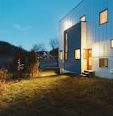 The rear of the house, which could have been treated as an afterthought given the project’s minimal budget, is instead a lively essay in form and color.