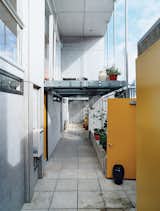 All three apartments, as well as Hiles and Fyfe’s deck, open onto this open-air corridor, allowing for casual interactions between the residents.