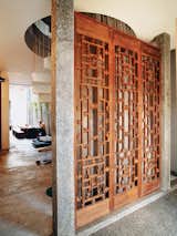 Doors, Wood, Swing Door Type, and Interior Once inside, visitors are greeted by three ten-foot-tall hand-carved antique panel doors.  Photo 2 of 9 in Straight and Narrow