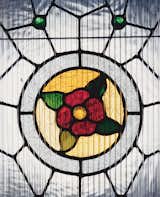 Although his designer friends give him a hard time about it, White decided to keep the original home’s stained glass by the entry.