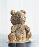 A gold-plated porcelain teddy bear.