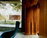 Living Room The fluted cherry front door, designed by Scarpa, launches a rippling motif that reappears in furniture and on walls. The Harry Bertoia Bird chair is from Knoll.  Photo 7 of 8 in Solar Inspiration