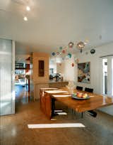 In the dining/kitchen area there are cabinets and floors made of oriented strand board (OSB) and a cherry dining table fabricated by Joe Cooper to the architects’ design.