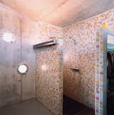Bath Room, Corner Shower, Open Shower, Wall Lighting, and Ceramic Tile Wall Cloud9’s Manel Soler Caralps, who completed the home’s interior design, created the tile pattern in the shower.  Photo 1 of 1 in Bathroom by Nige h from Suburban House of the Future by Cloud9