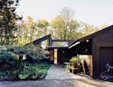 Designed in 1972 by local architect Edgar Waehrer, this home was renovated by creative director Ben Watson and his partner, painter Claudio Tschopp. As a later example of Northwest modernism, the home combined the clean lines and open plans of mid-century modernism with an emphasis on natural local materials and natural light. However, while the 16-foot ceilings in the home gave a sense of airiness, the plentiful wood paneling on the walls kept it dark and feeling damp, and so the couple bleached the walls to better reflect natural light.