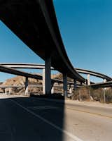 One of the most common uses of concrete is in infrastructural projects like highways, where they soar and wind through the sky. Most pieces are precast before arriving on site so that the structures can be built quicker. Typically, massive columns and bridges are produced in a manufacturing plant where construction conditions can be closely regulated.