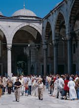 Devout Muslims and Western-style tourists congregate outside the Blue Mosque in the Sultanahmet district.