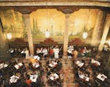 The interior of Sanborns Casa de los Azulejos restaurant features floor-to-ceiling murals in the courtyard of the historic palace.&nbsp;