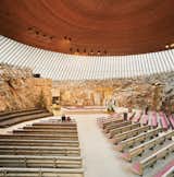 The 1969 Temppeliaukion Kirkko, or Rock Church as it is known, is one of the most popular places to visit in Helsinki. The dramatic interior space was created from a solid granite outcropping, and is often used as a concert hall because of its superior acoustics.  Photo 5 of 9 in Helsinki Rising