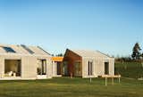 Sun shines through the glass and onto the concrete, heat-storing wall and floor in the hallway that separates the guestrooms from the main house. This "heat sink" keeps the Longhouse warm when the mercury dips.