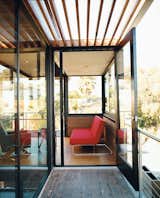 On the second floor, an open balcony of FSC-certified tigerwood with a cedar trellis leads into a light-filled study/guest bedroom.  Photo 4 of 7 in LEEDing the Way
