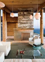 A reclaimed-wood fireplace is a defining feature in the living room.