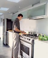 Reitz in the kitchen, which is outfitted with efficient fluorescent lighting and Energy Star appliances.  Photo 3 of 4 in Taking His Own Advice