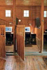 The stalls provide the same demarcated, cozy space for concentration as a cubicle, but the effect is warm and rich rather than garish and chintzy.
