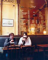 Patrons at A La Mort Subite enjoy a modest glass of Belgian ale.