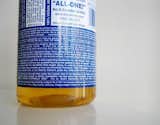 Dr. Bronner's All in One Soap with its font-centric graphic labels, $4-$15  Search “how one family three does it all 675 square feet” from 10 Modern Gifts Under $20