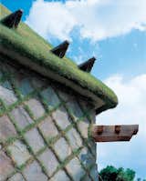 For Camellia Castle, which houses a sake brewery, Fujimori designed a grass-covered roof and a cladding comprised of grass-and-stone checkerboard.