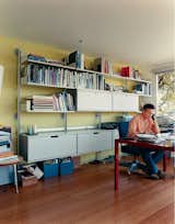 What was once a boat room now serves as a home office. The engineered bamboo floors are from Eco Timber. The modular shelving and storage systems are by Vitsoe.
