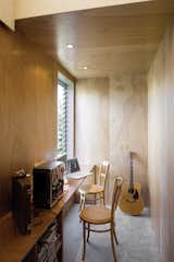 The study is narrow but illuminated by a window, louvered like others in the house to help regulate heat.