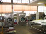 From there it's into the industrial washing machines to clean the tarps up for production.