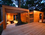 The Dominey Pavillion by Lightroom Studio is sited behind the Decatur, Georgia, home of family of Case Study House enthusiasts. The project includes a deck, outdoor living room, garden, carport, and driveway.