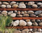 One of Levine’s design experiments is this “thermal rock wall” of loosely stacked stones.