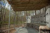 Bambooze! by Rebecca Popowsky and Riggs SkepnekThe walls of the Bambooze! are made from bales of locally produced straw that are secured with bamboo stakes. The stakes protrude out of the top of the walls to support the roof, also made from bamboo. The roof slopes forward to guide rainwater to the garden in front of the structure.Photo by Jack Ramsdale. Courtesy of  the Schuylkill Center for Environmental Education.