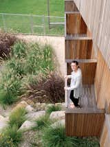 Joanna Ferguson stands on one of the balconies extending from the guest bedrooms.